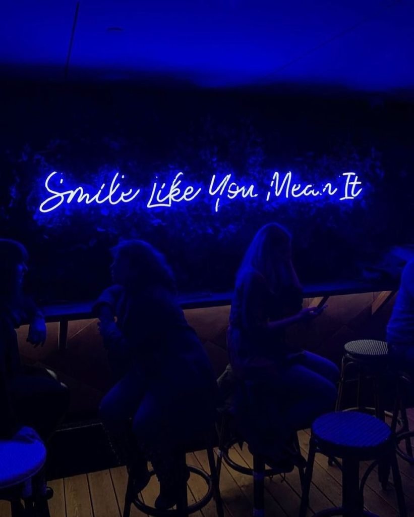 smile like you mean it neon sign